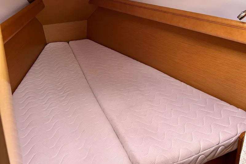 Slide: The Image of Cabin interior of 2012 Jeanneau Sun Odyssey 379 with twin mattresses. - 23