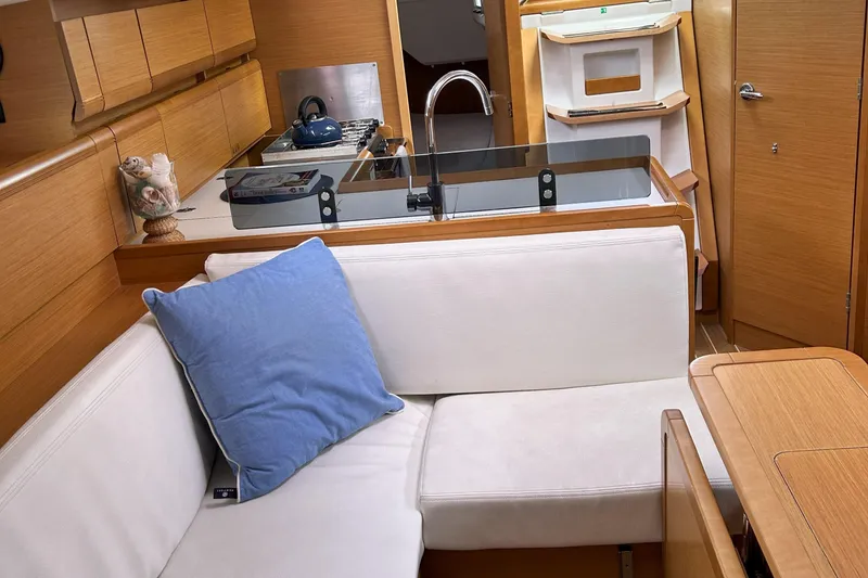 Slide: The Image of Interior of 2012 Jeanneau Sun Odyssey 379 yacht with cozy seating and modern kitchen area. - 25