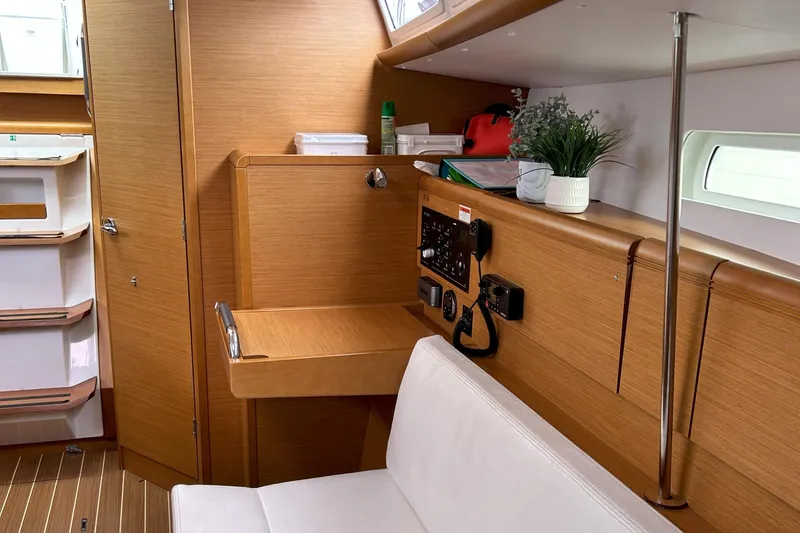 Slide: The Image of Interior of 2012 Jeanneau Sun Odyssey 379 sailboat with navigation station and seating. - 26
