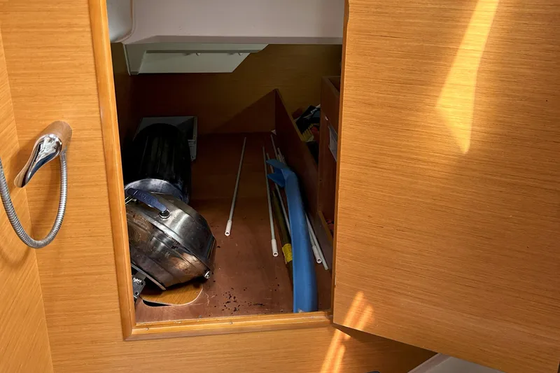 Slide: The Image of Storage compartment on 2012 Jeanneau Sun Odyssey 379 sailboat with various equipment. - 29