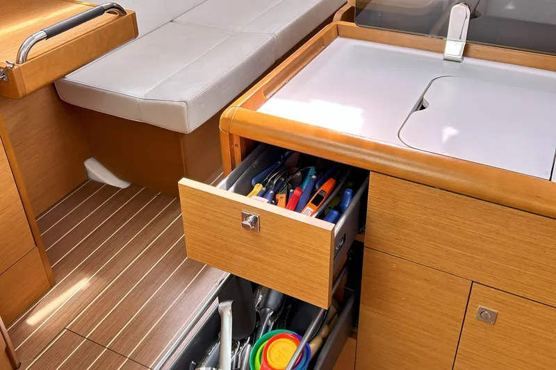 Slide: The Image of Interior of 2012 Jeanneau Sun Odyssey 379 yacht with open drawer and seating area. - 34