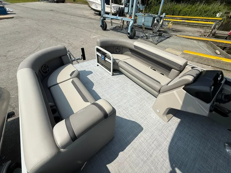 Slide: The Image of 2025 Premier 200 Sunscape RE XLC pontoon boat interior with plush seating and modern design. - 12