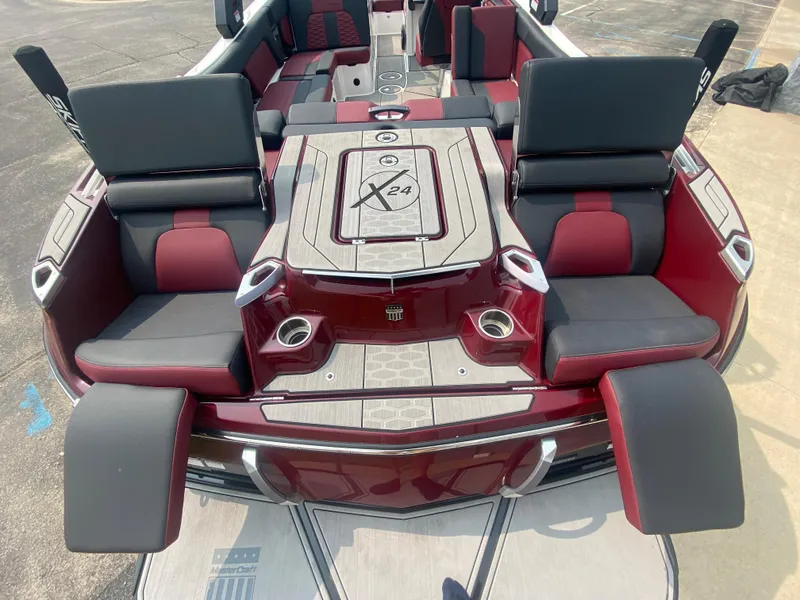 Slide: The Image of 2022 MasterCraft X24 boat interior with luxurious seating and modern design. - 11