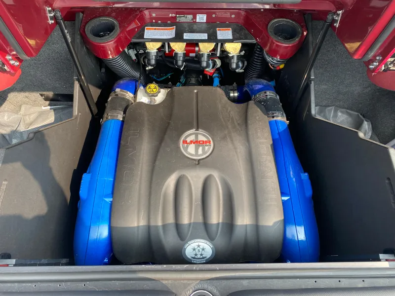 Slide: The Image of 2022 MasterCraft X24 engine compartment with Ilmor engine, featuring blue accents and detailed components. - 22