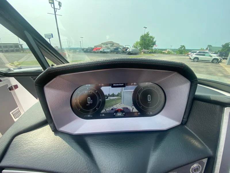 Slide: The Image of 2022 MasterCraft X24 dashboard display with digital gauges and navigation screen. - 36