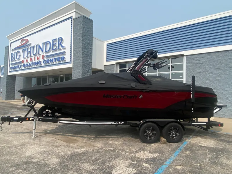 Slide: The Image of 2022 MasterCraft X24 boat with cover at Big Thunder Marine dealership. - 45