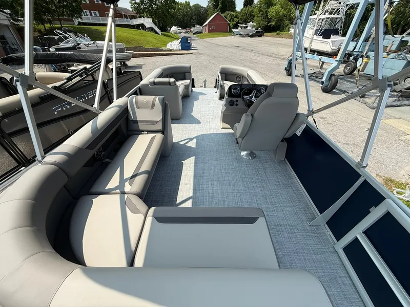 Slide: The Image of 2025 Premier 200 Sunscape RE XLC pontoon boat with spacious seating and modern design. - 9