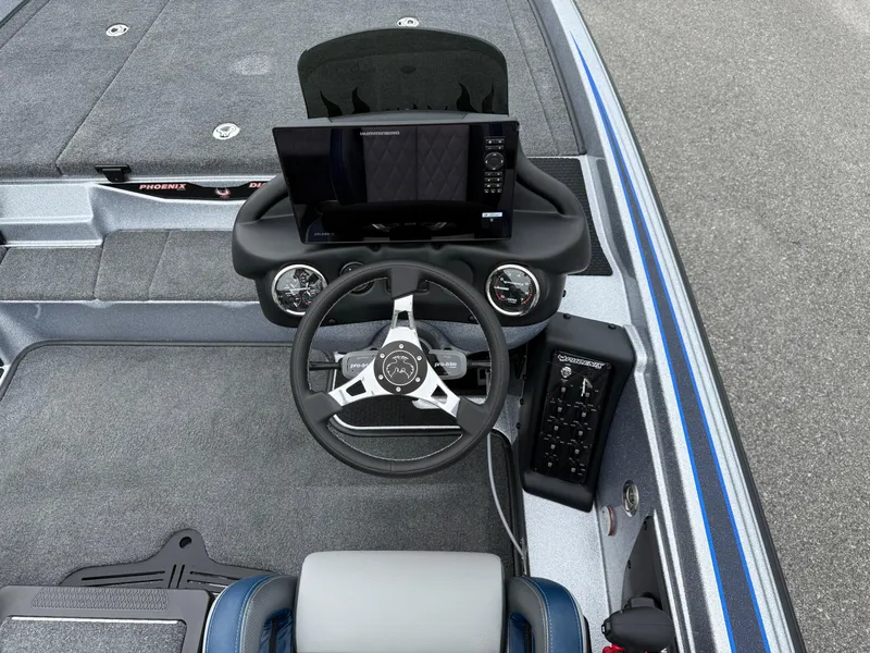 Slide: The Image of Dashboard of 2026 Phoenix 721 ZXL boat with steering wheel and electronic display. - 12