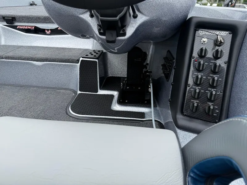 Slide: The Image of Interior view of 2026 Phoenix 721 ZXL boat dashboard with control panel and steering wheel. - 14