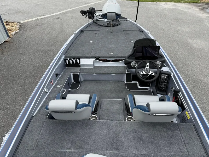 Slide: The Image of 2026 Phoenix 721 ZXL boat interior with dual seats, steering console, and spacious deck. - 17
