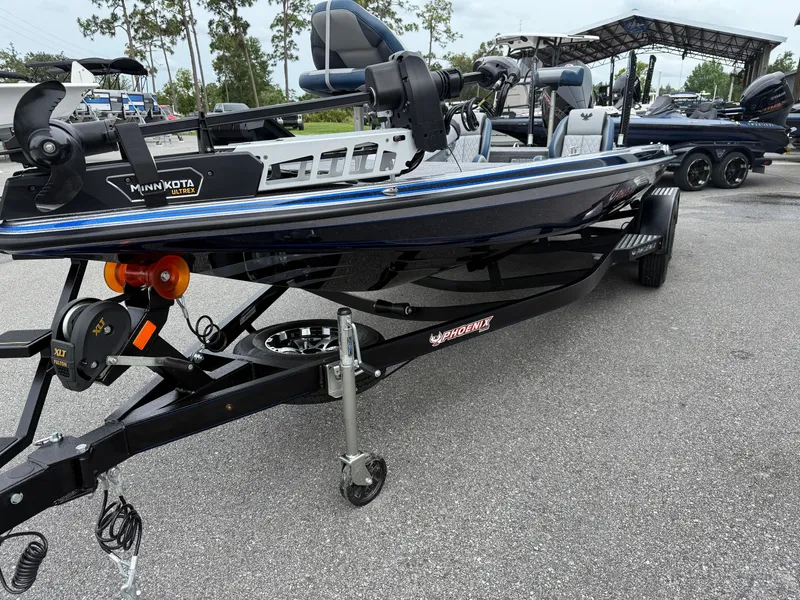 Slide: The Image of 2026 Phoenix 721 ZXL boat on trailer, featuring Minn Kota trolling motor. - 3