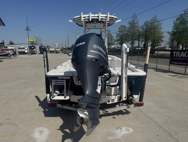 Slide: The Image of 2017 Sportsman Masters 247 Bay Boat with Yamaha 300 outboard motor, parked outdoors. - 3