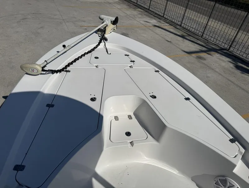 Slide: The Image of 2017 Sportsman Masters 247 Bay Boat deck with trolling motor and storage compartments. - 6