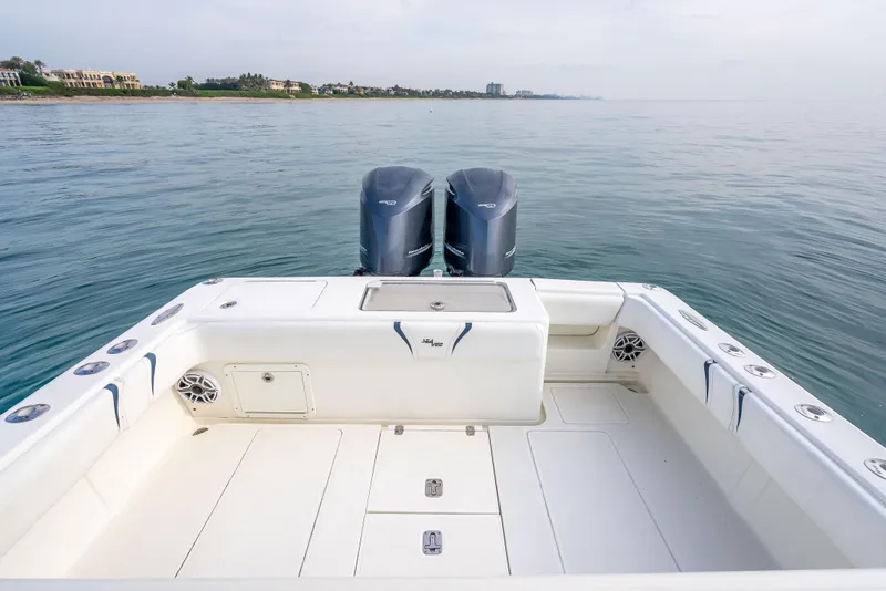 Slide: The Image of 2014 SeaVee 34 boat with dual engines on calm water. - 34