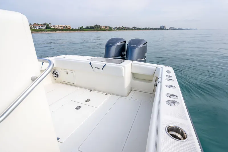 Slide: The Image of 2014 SeaVee 34 boat with dual engines on calm water. - 35