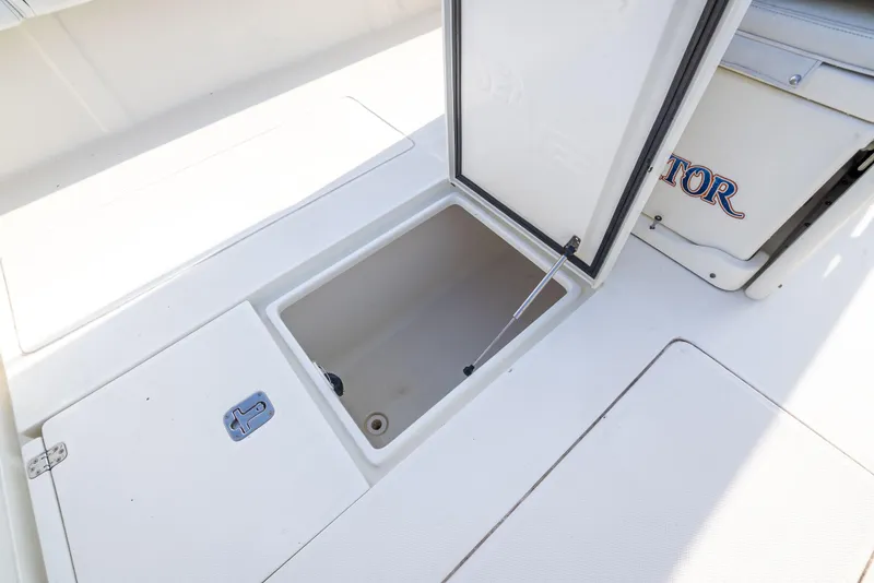 Slide: The Image of 2014 SeaVee 34 boat storage compartment with open hatch, showcasing spacious interior. - 38