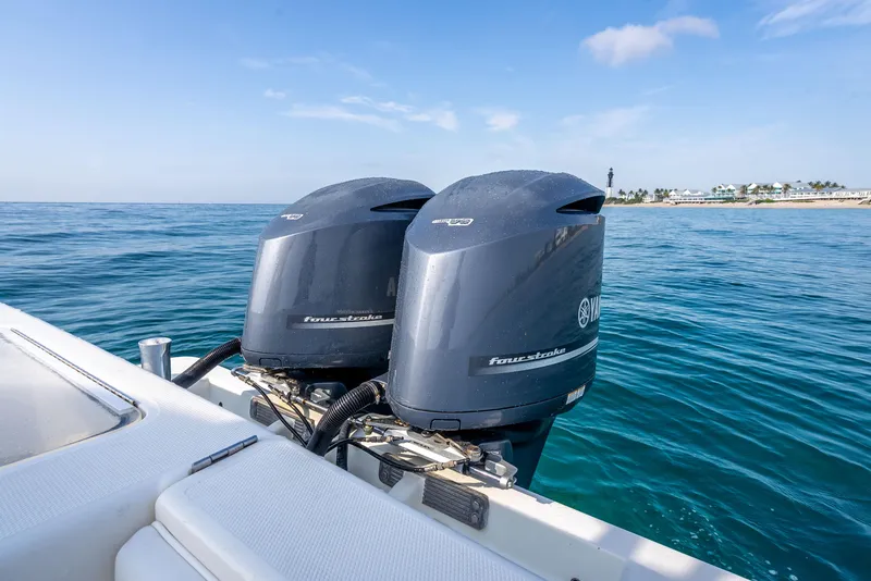 Slide: The Image of 2014 SeaVee 34 boat with twin outboard engines on open water. - 40