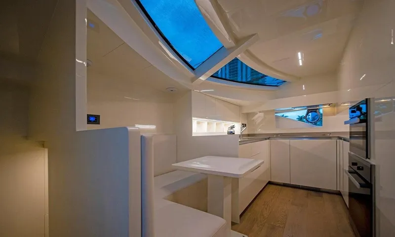 Slide: The Image of Luxurious interior of 2018 Ferretti Yachts 850 Motoryacht with modern kitchen and seating area. - 10