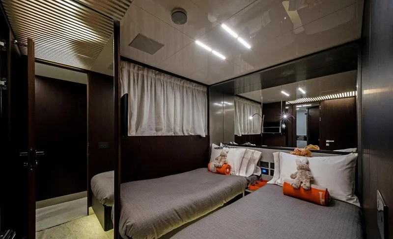 Slide: The Image of Luxurious twin bedroom in 2018 Ferretti Yachts 850 Motoryacht, featuring elegant decor and plush bedding. - 9