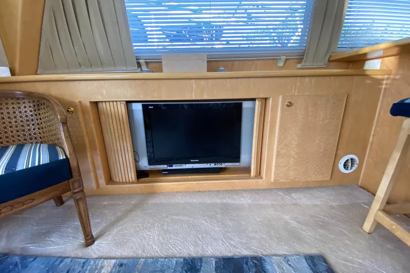 Slide: The Image of Control panels on a 1998 Navigator 5300 Classic yacht, featuring Sea Tel and thermostat systems. - 11