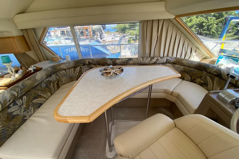 Slide: The Image of Interior of 1998 Navigator 5300 Classic yacht with helm, seating, and table. - 15