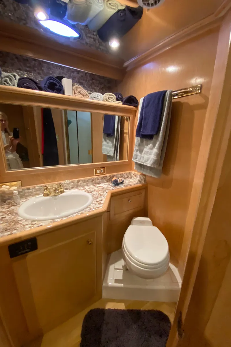 Slide: The Image of Bunk beds in 1998 Navigator 5300 Classic yacht cabin with striped bedding and porthole window. - 23