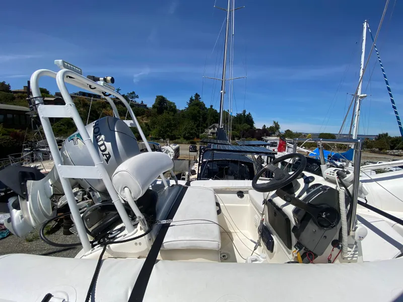 Slide: The Image of 1998 Navigator 5300 Classic yacht with white seating and tender on deck. - 29