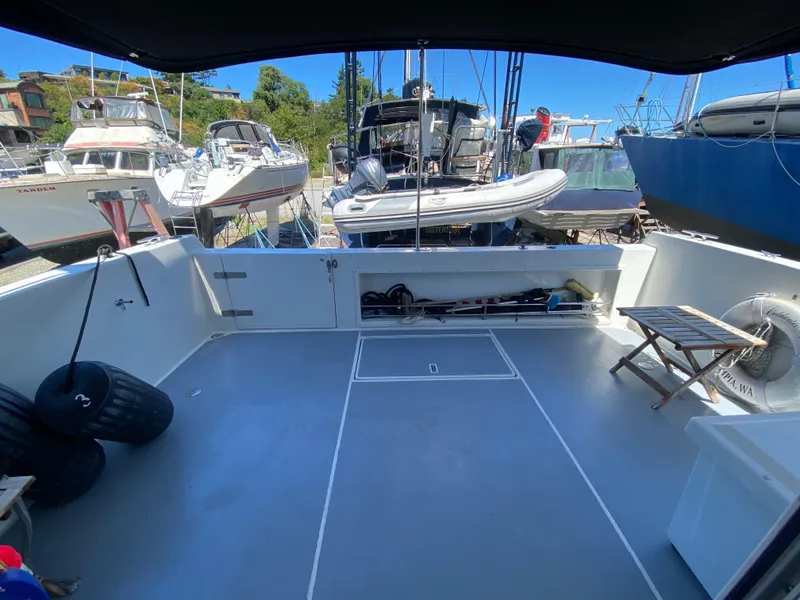 Slide: The Image of 1998 Navigator 5300 Classic yacht docked, featuring "Coldwater Fusion" name, serene water backdrop. - 3