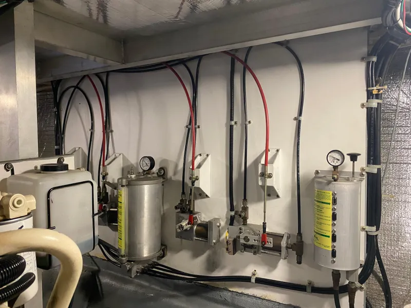 Slide: The Image of Engine room of a 1998 Navigator 5300 Classic yacht, showcasing mechanical components. - 39