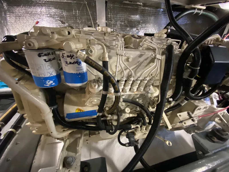 Slide: The Image of Engine compartment of a 1998 Navigator 5300 Classic yacht, showcasing detailed mechanical components. - 43