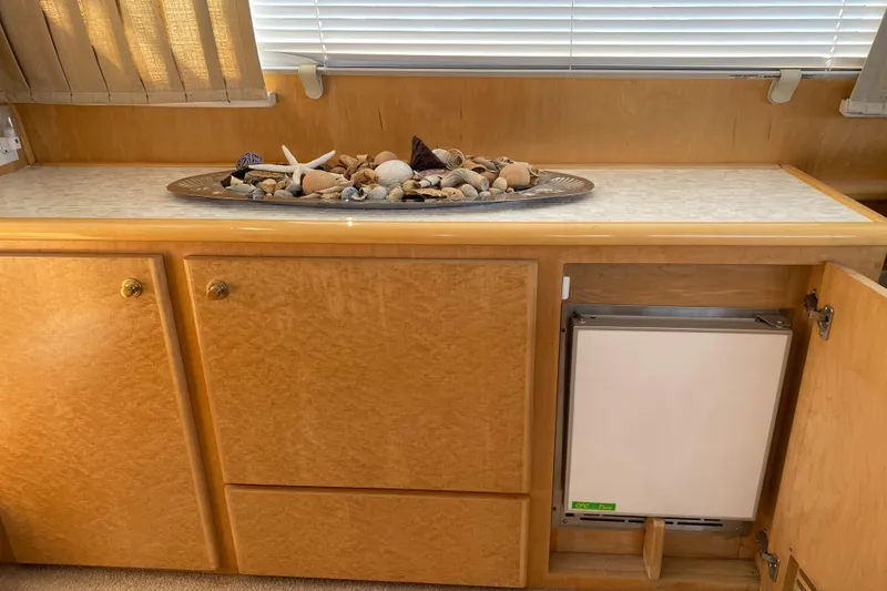 Slide: The Image of 1998 Navigator 5300 Classic galley with wood cabinets, countertop, and microwave. - 8
