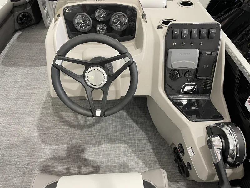 Slide: The Image of 2025 Princecraft Vectra 21 RL boat dashboard with steering wheel and control panel. - 13