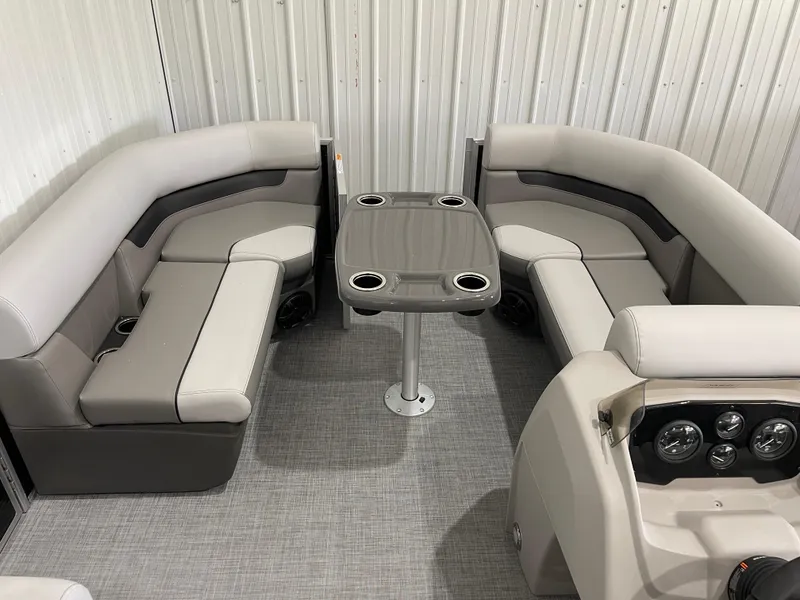 Slide: The Image of 2025 Princecraft Vectra 21 RL interior with gray seating and table, featuring cup holders. - 14