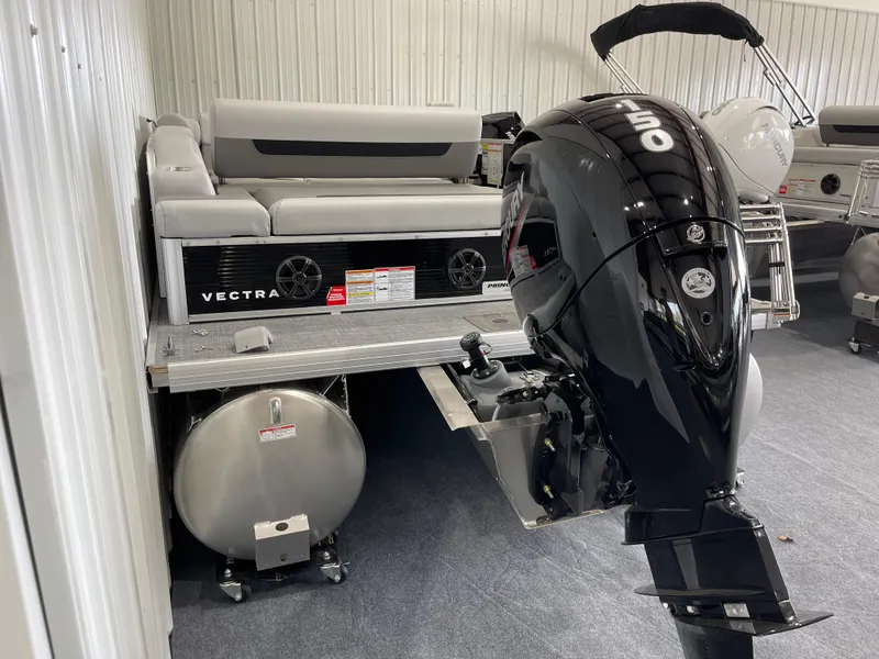 Slide: The Image of 2025 Princecraft Vectra 21 RL pontoon boat with outboard motor in showroom. - 3