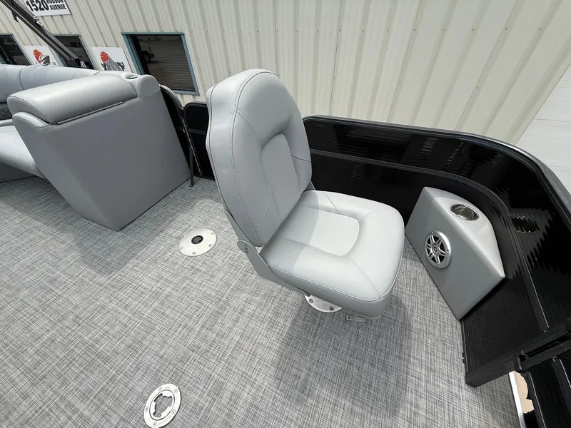 Slide: The Image of 2018 Misty Harbor 2085 Biscayne Bay FS boat with gray seating and speaker. - 13