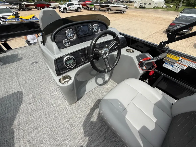 Slide: The Image of 2018 Misty Harbor 2085 Biscayne Bay FS boat dashboard with steering wheel and controls. - 15