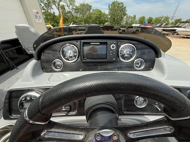 Slide: The Image of Dashboard of 2018 Misty Harbor 2085 Biscayne Bay FS boat with steering wheel and gauges. - 16
