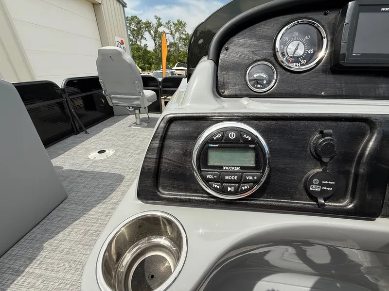 Slide: The Image of 2018 Misty Harbor 2085 Biscayne Bay FS dashboard with audio controls and gauges. - 17