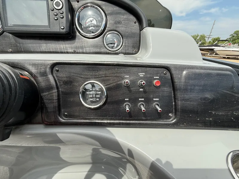 Slide: The Image of Control panel of 2018 Misty Harbor 2085 Biscayne Bay FS boat with gauges and switches. - 18
