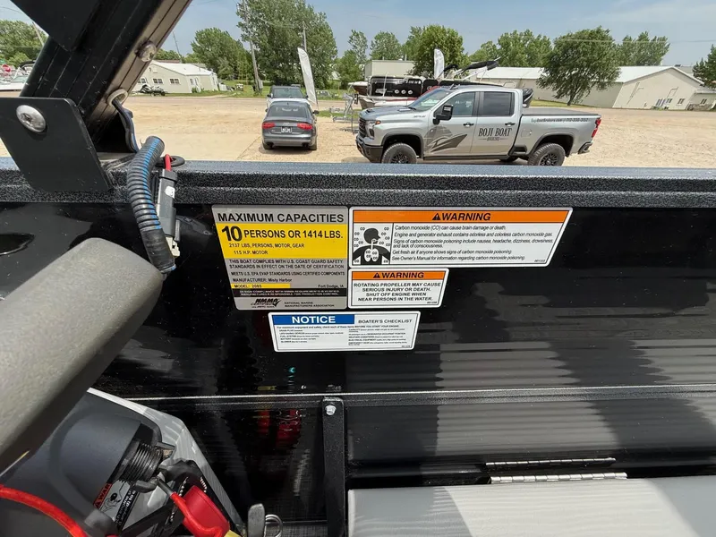 Slide: The Image of 2018 Misty Harbor 2085 Biscayne Bay FS boat capacity and safety warning labels. - 20