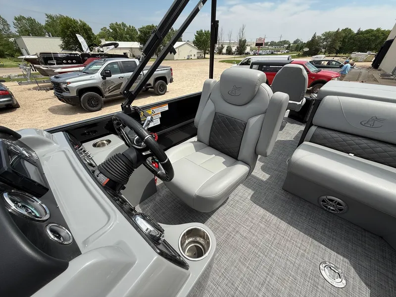 Slide: The Image of 2018 Misty Harbor 2085 Biscayne Bay FS boat interior with gray seating and steering console. - 21