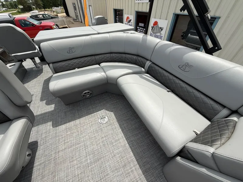 Slide: The Image of 2018 Misty Harbor 2085 Biscayne Bay FS boat interior with gray cushioned seating. - 23