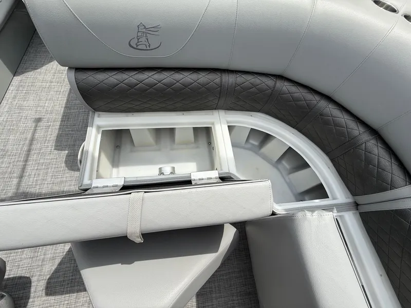 Slide: The Image of 2018 Misty Harbor 2085 Biscayne Bay FS boat seating with storage compartment open. - 25