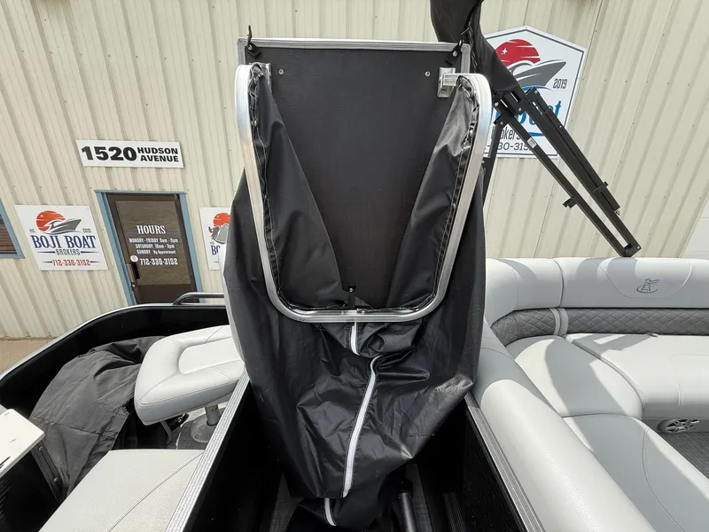 Slide: The Image of 2018 Misty Harbor 2085 Biscayne Bay FS boat interior with seating and cover. - 29