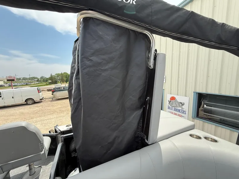 Slide: The Image of 2018 Misty Harbor 2085 Biscayne Bay FS boat with covered seating area and cup holders. - 30