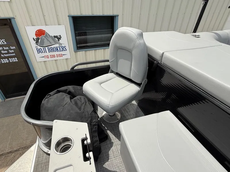 Slide: The Image of 2018 Misty Harbor 2085 Biscayne Bay FS boat seat with cup holder, near Boji Brokers sign. - 33