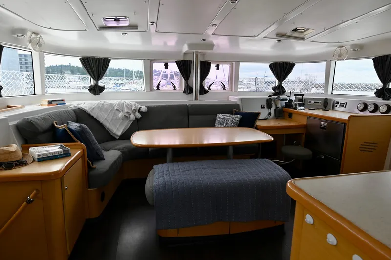 Slide: The Image of Interior of 2009 Lagoon 440 catamaran with cozy seating and dining area. - 20