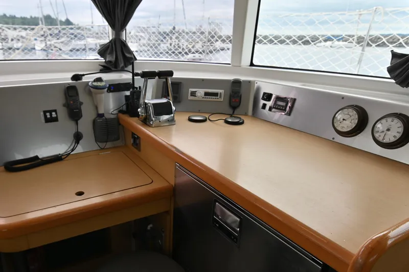 Slide: The Image of Interior helm station of 2009 Lagoon 440 catamaran with navigation equipment and controls. - 22