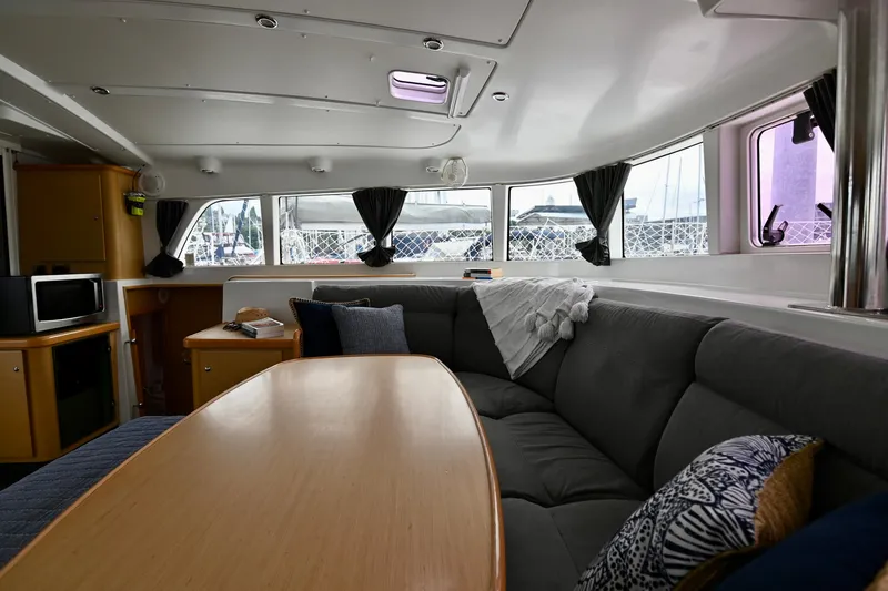 Slide: The Image of Interior of 2009 Lagoon 440 catamaran with cozy seating and modern amenities. - 27