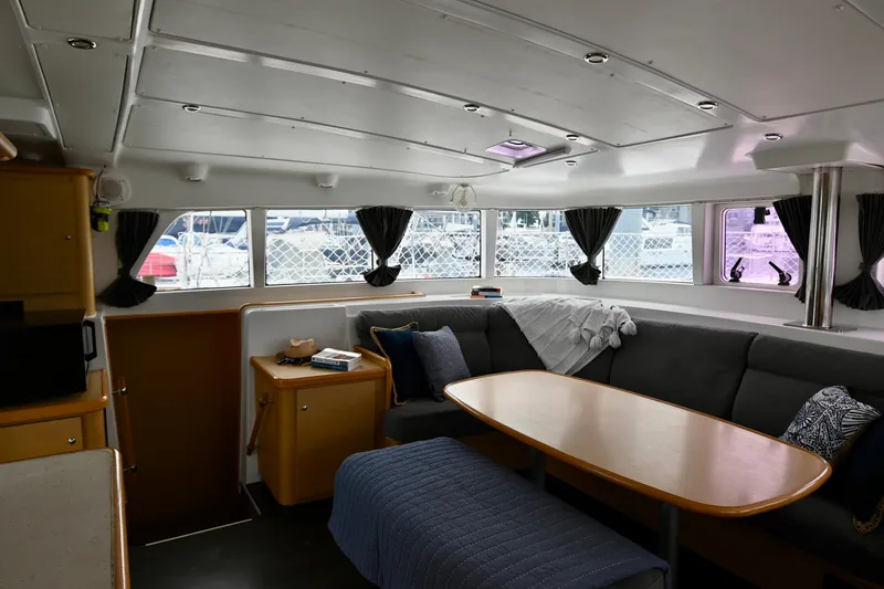 Slide: The Image of Interior of 2009 Lagoon 440 catamaran with cozy seating and dining area. - 31